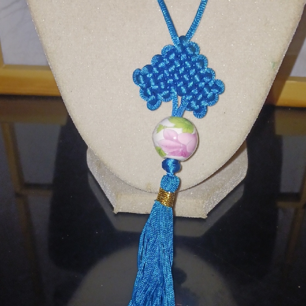 Blue Knotted Pendant Necklace with Floral Bead